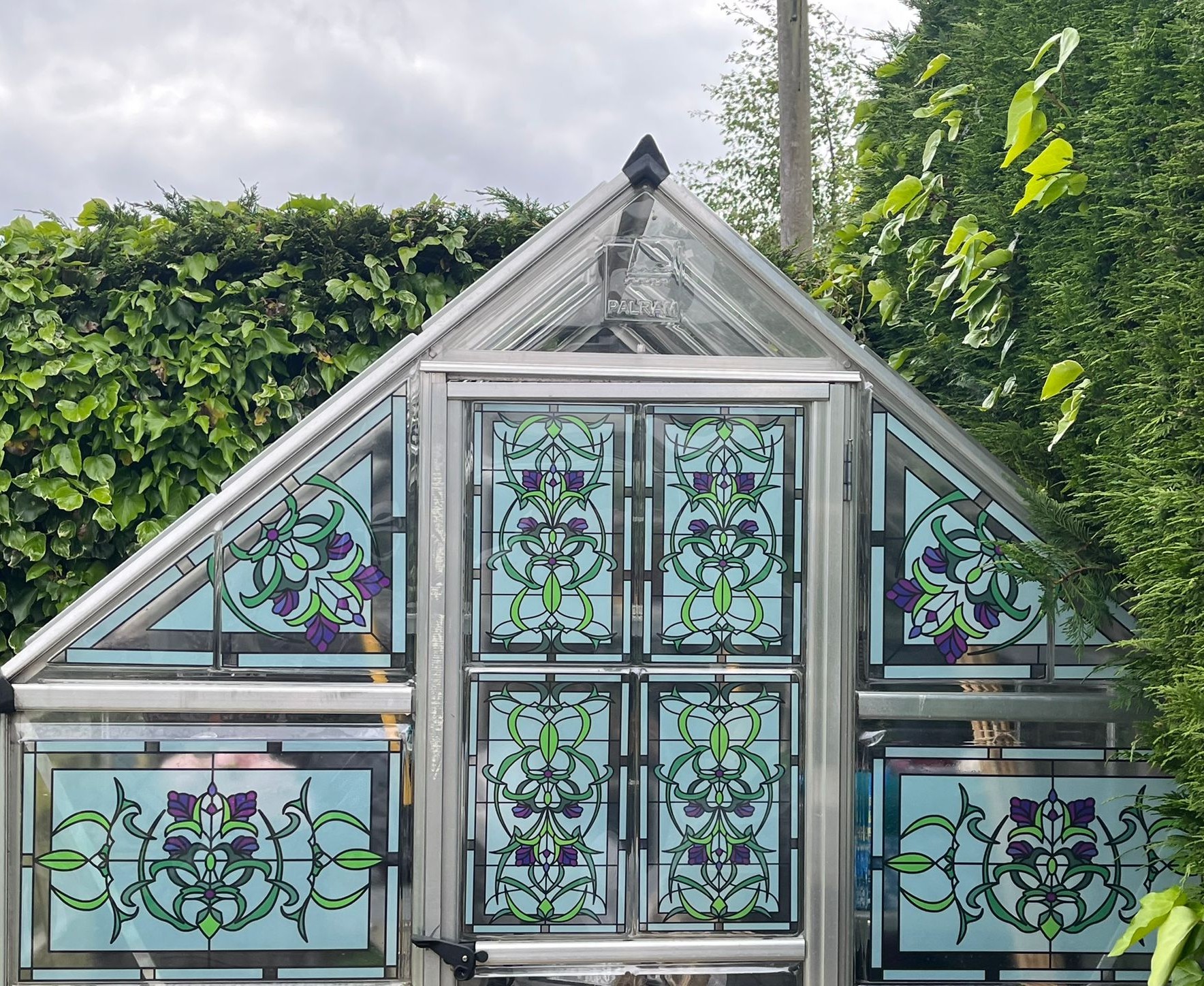 stained glass film installed on a glass greenhouse.jpg