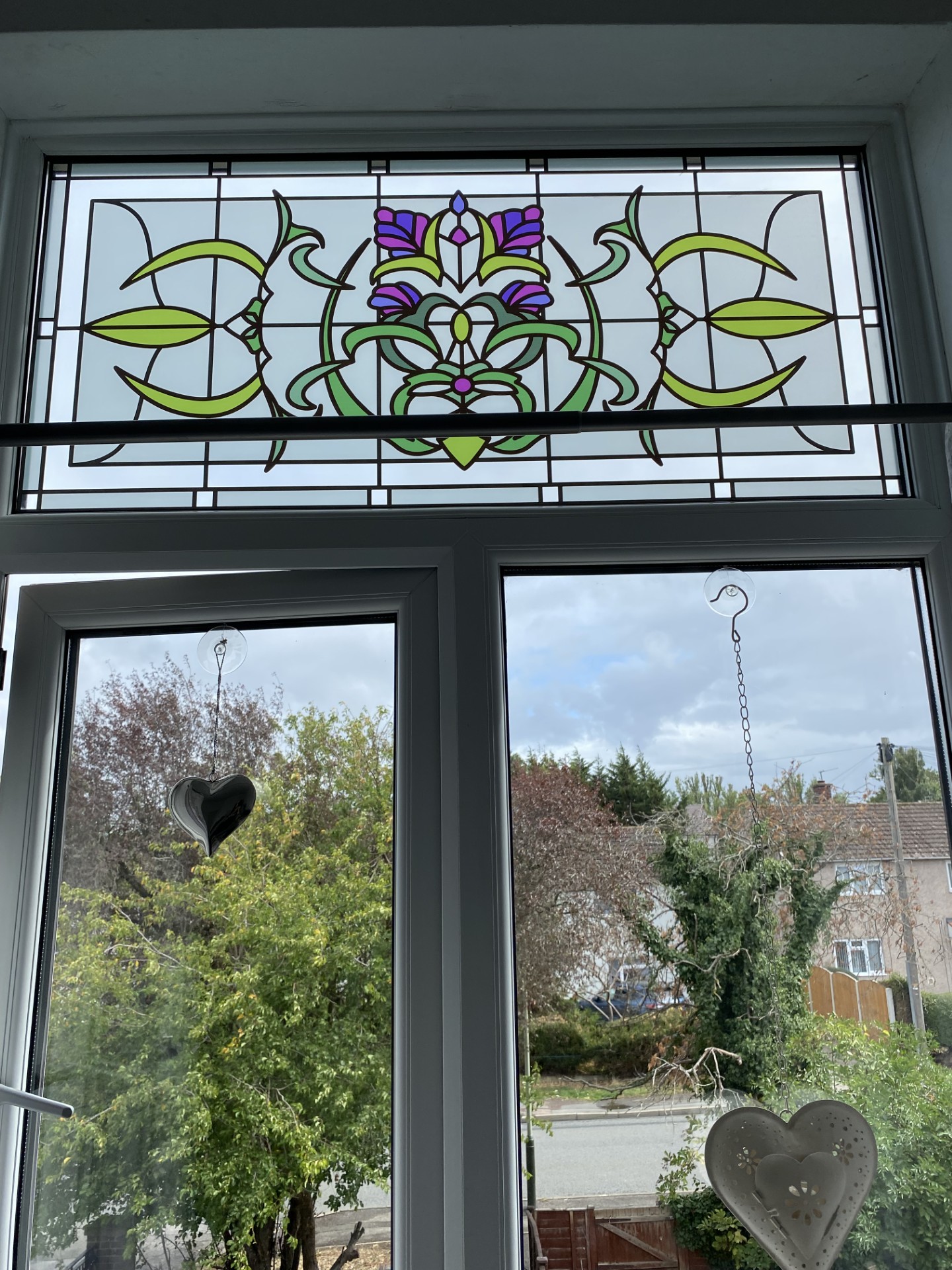 sintaed glass film with a centre purple flower.jpg