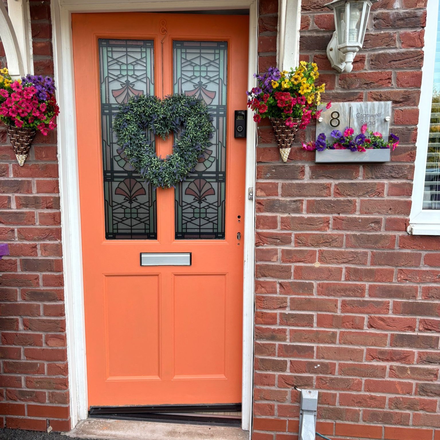 Beatrice stained glass window sticker on orange door.jpg