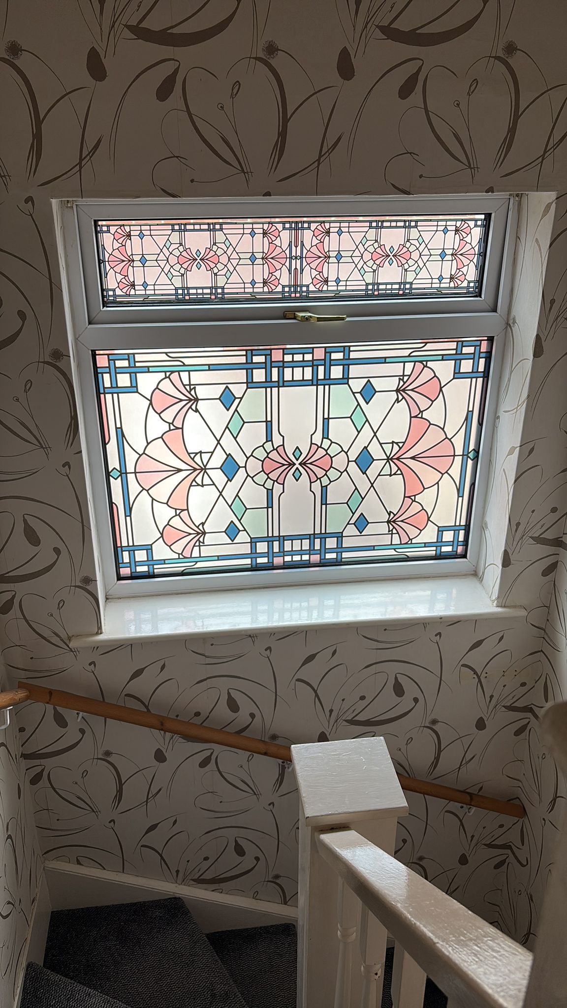 Beatrice stained glass window film installed in a landscape window..jpg