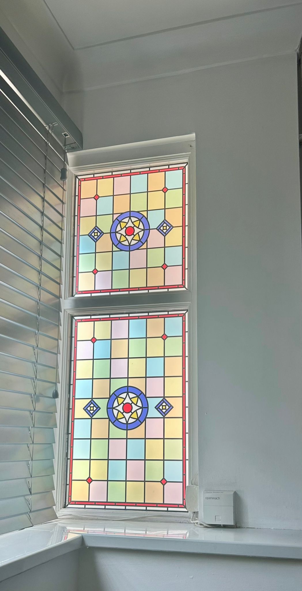 privacy window film installed on a corner window stained glass film.jpg