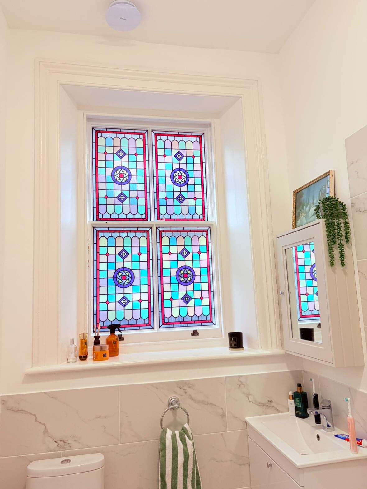 barbara stained glass window film installed in on a bathroom window for window privacy.jpg