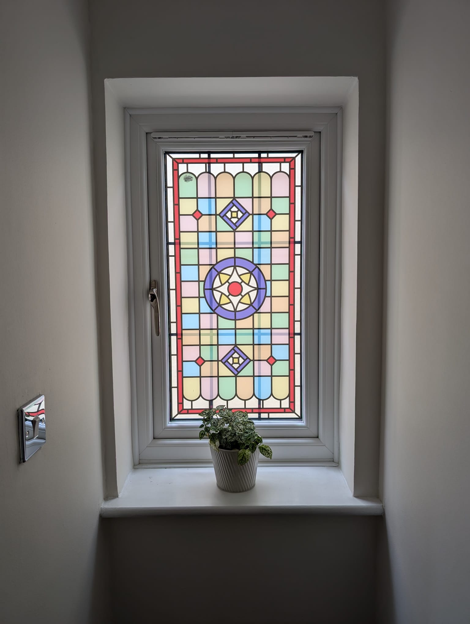 a rectangle stained glass film installed on a hallway window.jpg