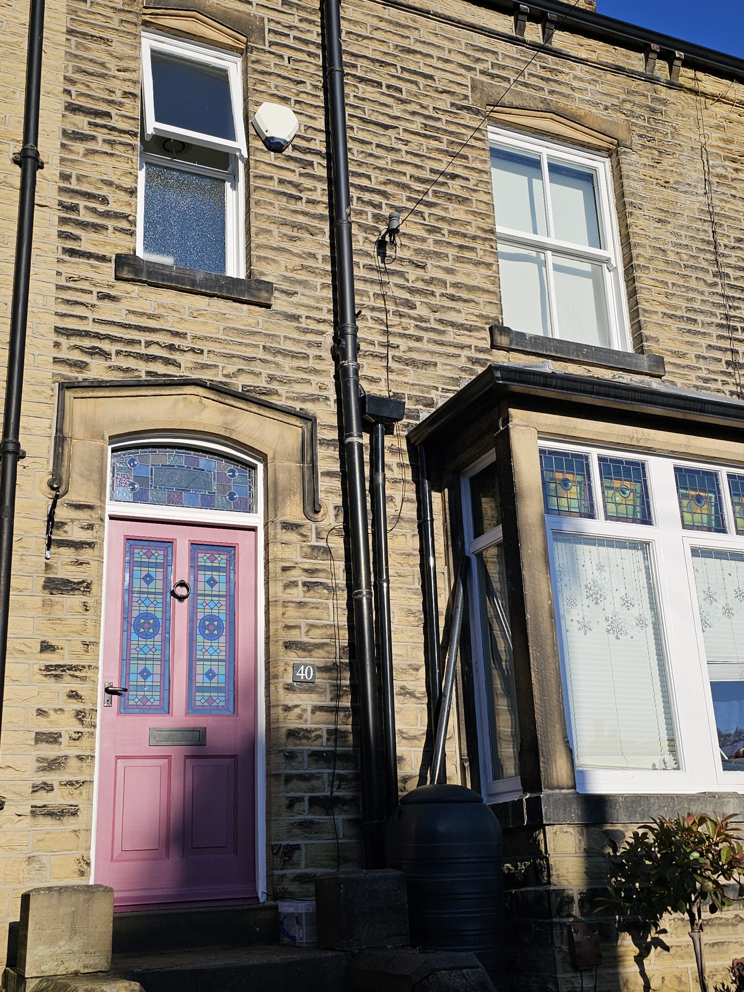 barbara stained glass window film installed on a pink door..jpg