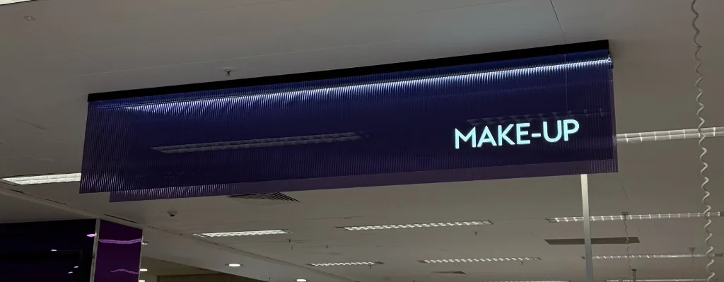 deep purple coloured reeded film used for illuminated make-up retail signage