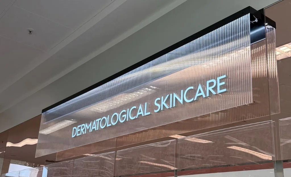 typography on coloured reeded film for a dermatological skincare retail sign